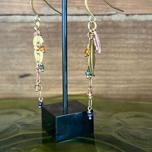Feather and crystal dangle earrings